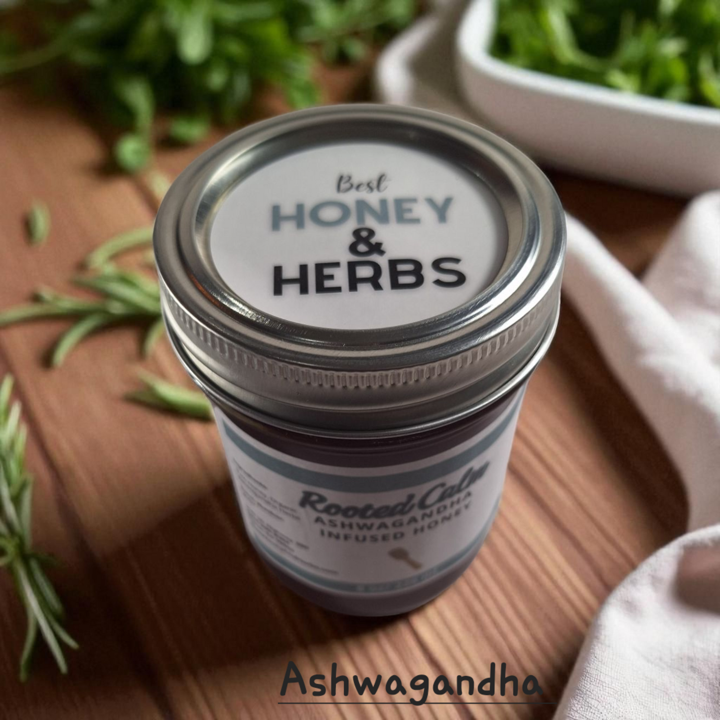 Top view of 8 oz half-pint jar of raw Ashwagandha Infused Honey on a rustic wooden surface, small-batch herbal sweetener for tea, baking, and natural wellness.