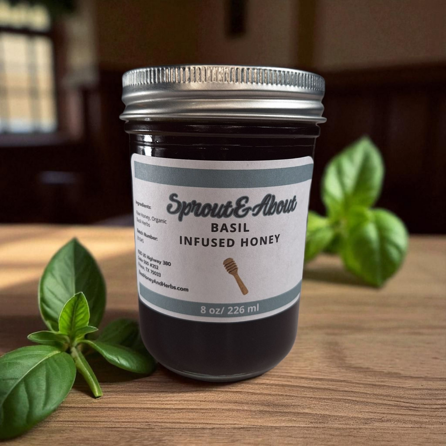 8 oz half-pint jar of raw Basil Infused Honey on a wooden surface, small-batch herbal honey perfect for drizzling on bread, salads, or cheese.