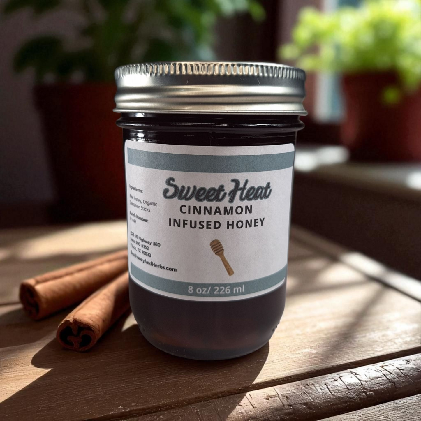 8 oz half-pint jar of raw Cinnamon Infused Honey on a rustic wooden surface, warm spiced sweetener for coffee, oatmeal, tea, and desserts.