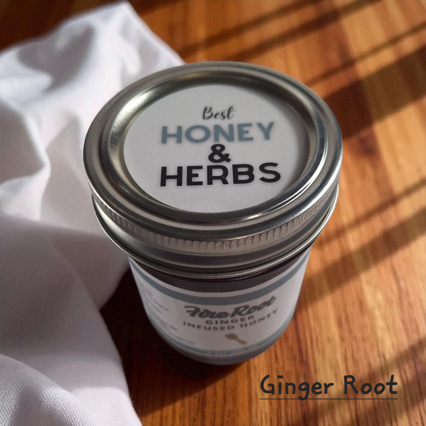 Top view of 8 oz half-pint jar of raw Ginger Infused Honey on a rustic wooden surface, zesty herbal sweetener for tea, baking, and immune-boosting recipes.