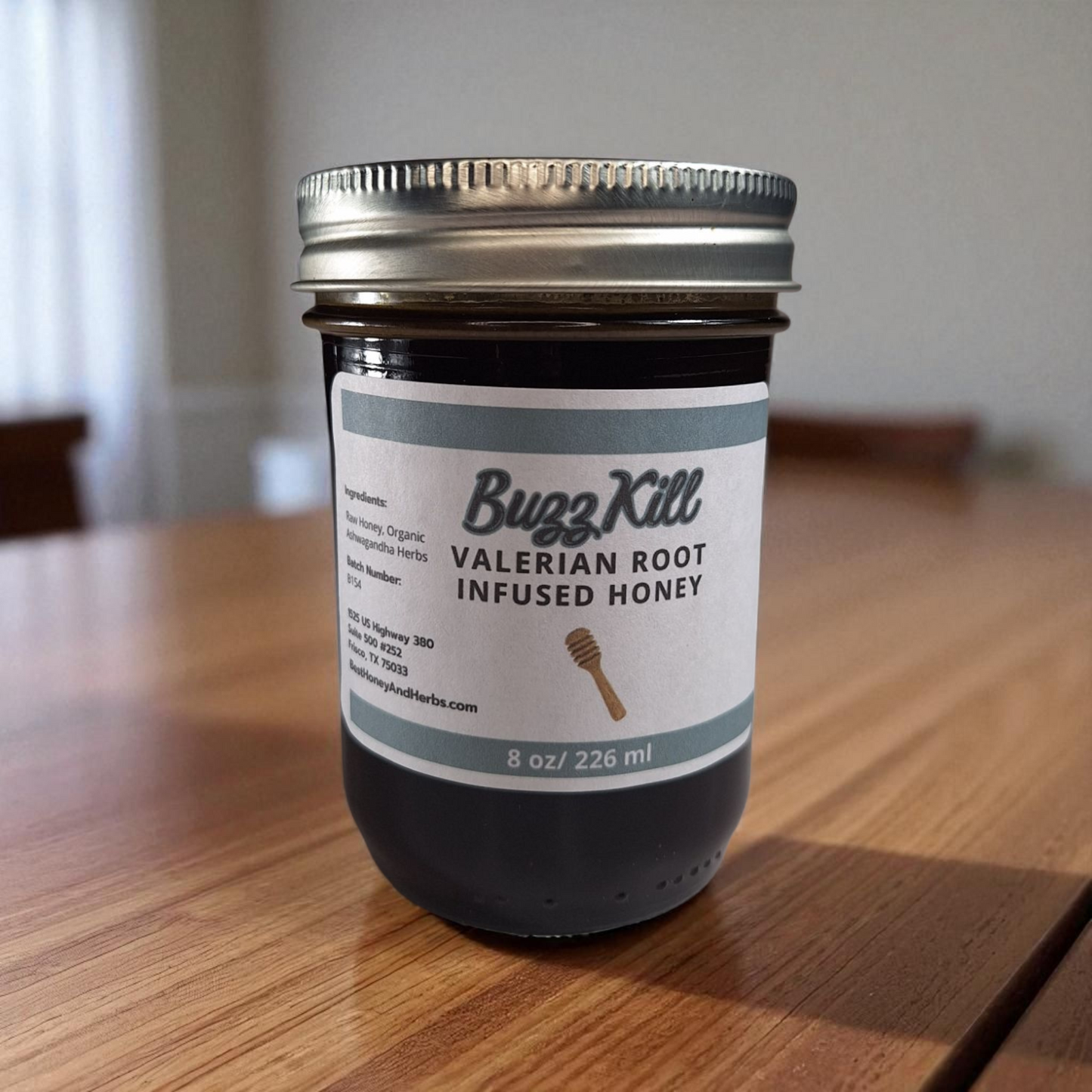 8 oz half-pint jar of raw Valerian Root Infused Honey on a rustic wooden surface, small-batch calming herbal sweetener for tea, baking, and relaxation drinks.