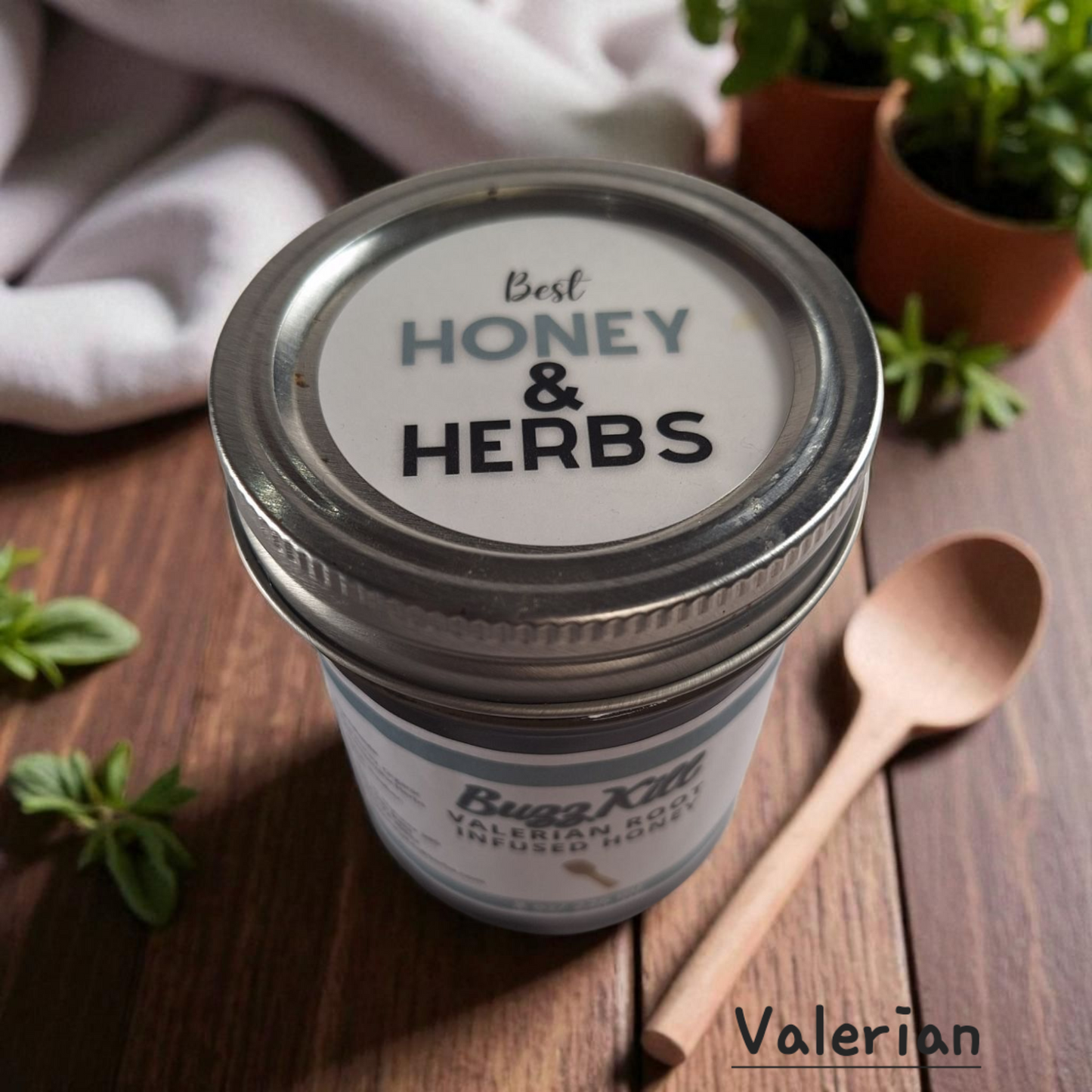 Top view of 8 oz half-pint jar of raw Valerian Root Infused Honey on a rustic wooden surface, calming herbal sweetener for tea, baking, and relaxation drinks.