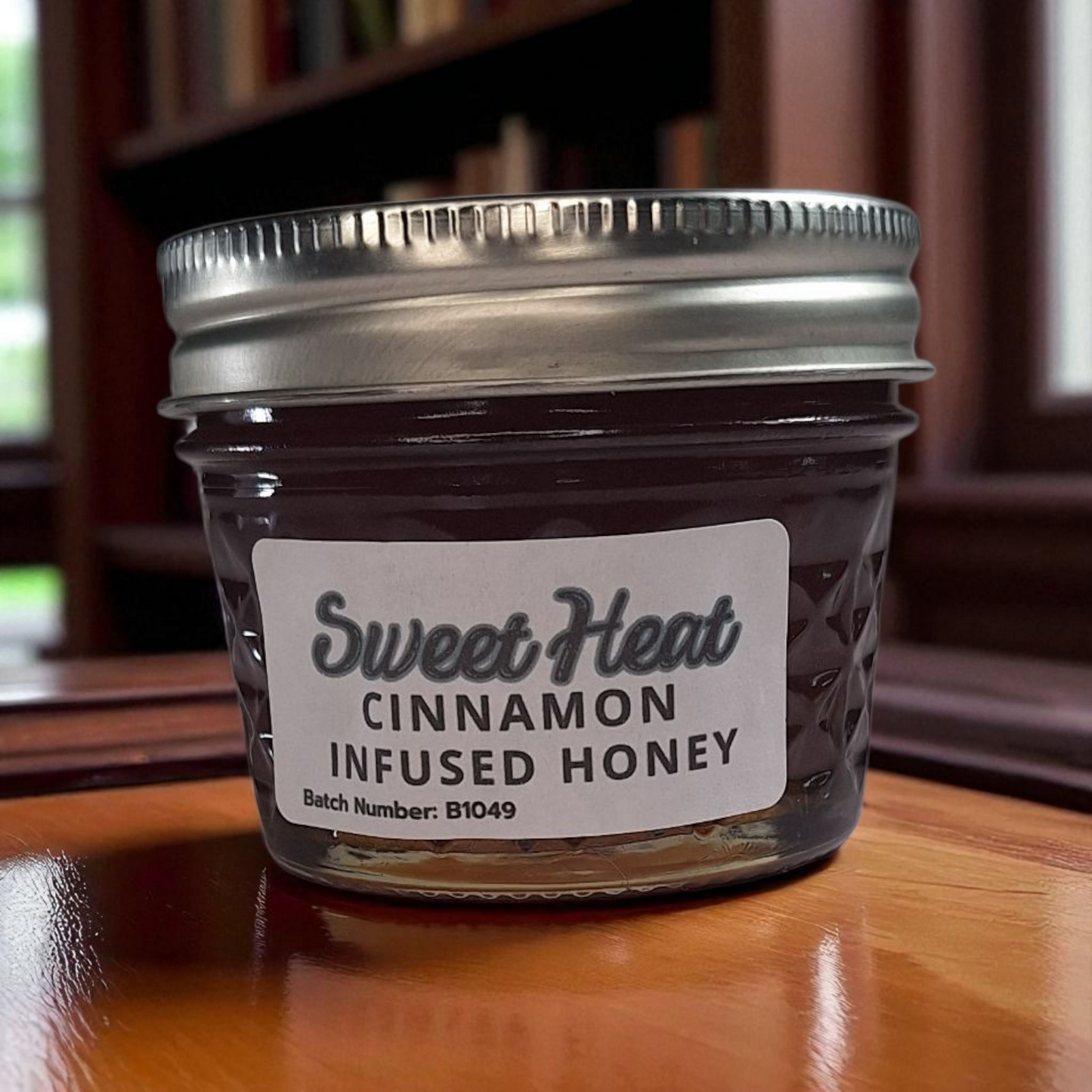 4 oz jar of raw Cinnamon Infused Honey on a rustic wooden surface, warm spiced sweetener for coffee, oatmeal, tea, and desserts.