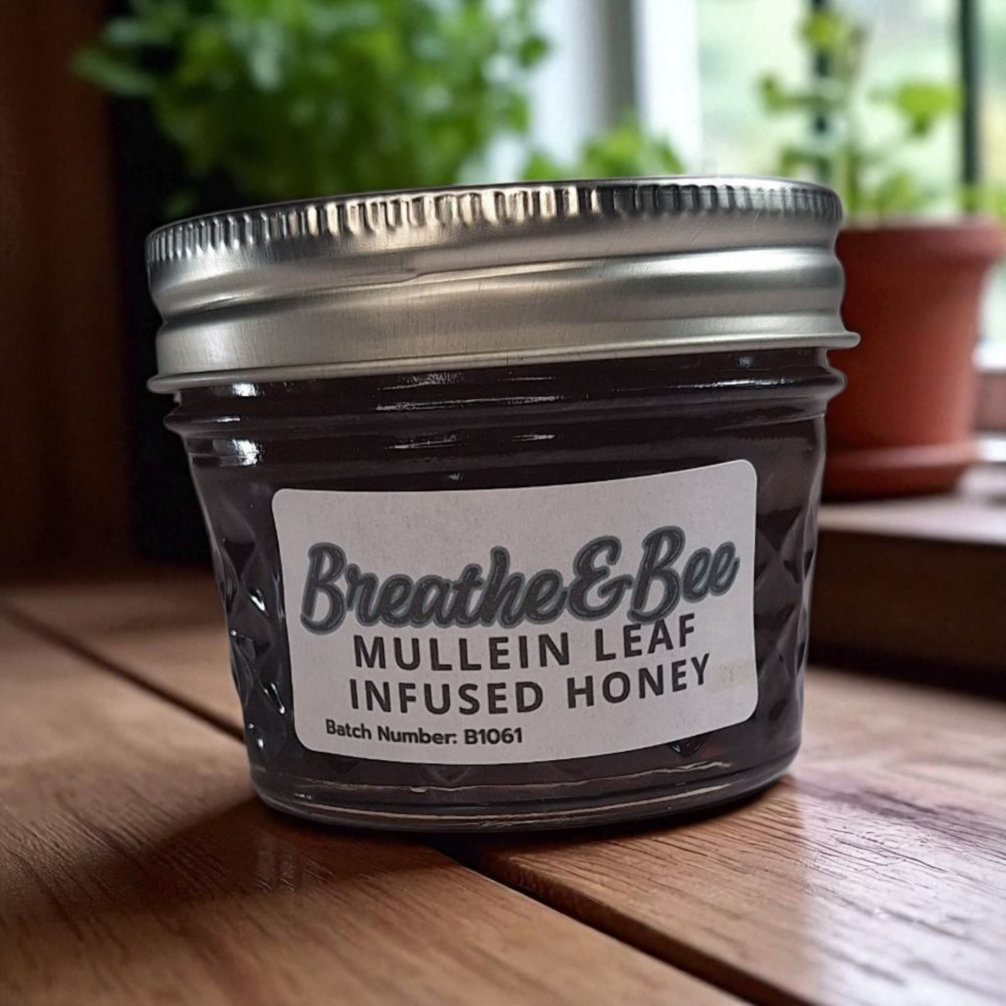 4 oz jar of raw Mullein Leaf Infused Honey on a rustic wooden surface, soothing herbal sweetener for tea, throat comfort, and natural wellness.