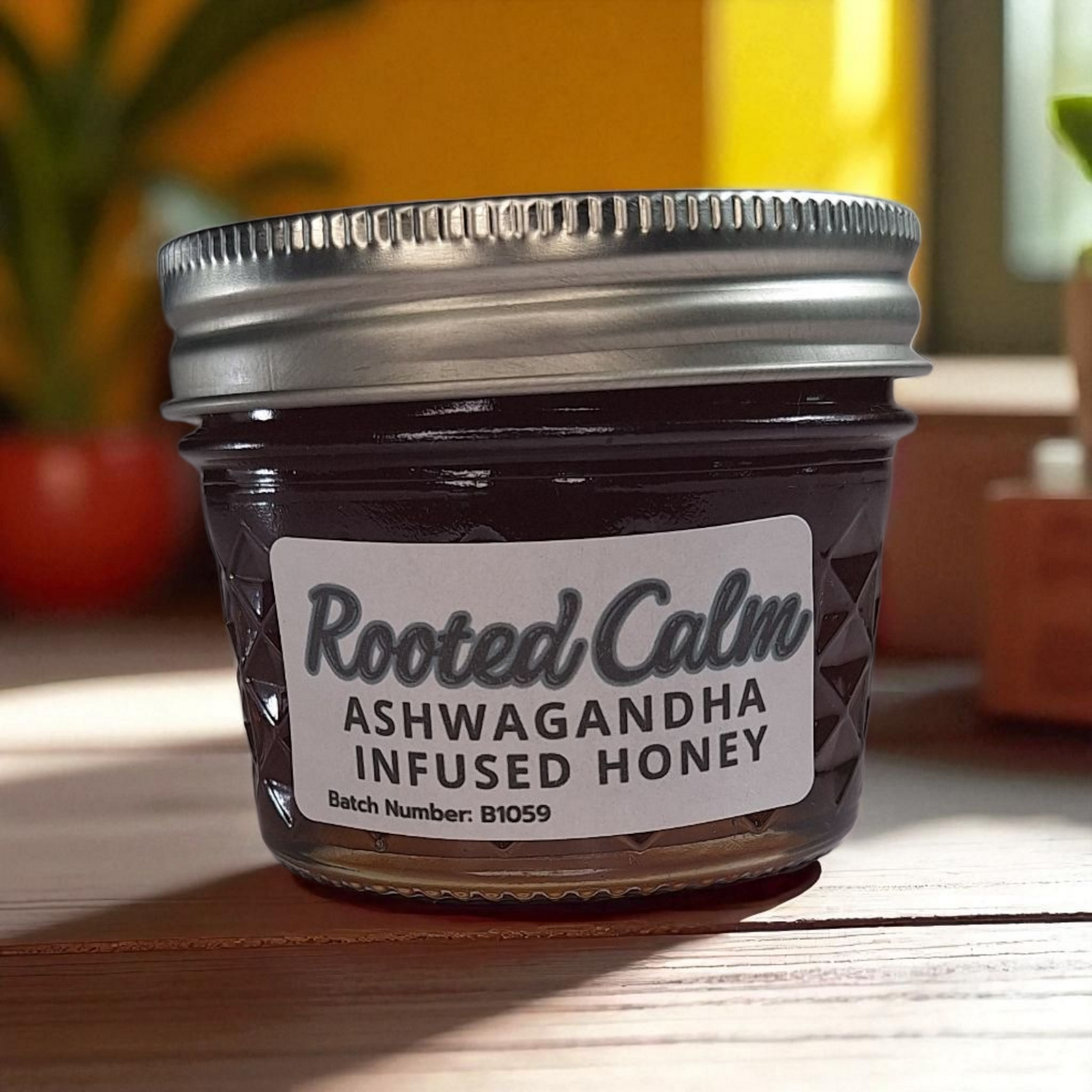 4 oz jar of raw Ashwagandha Infused Honey on a rustic wooden surface, small-batch herbal sweetener for tea, baking, and natural wellness.