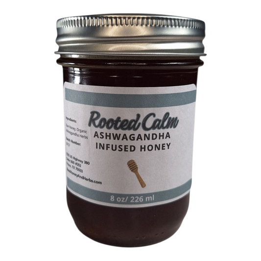  8 oz jar of raw Ashwagandha Infused Honey, small-batch herbal sweetener for tea, baking, and wellness remedies on a plain white background.
