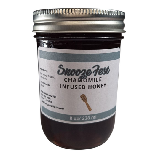 8 oz jar of raw Chamomile Infused Honey, calming herbal honey for tea, baking, and natural relaxation, on a plain white background.