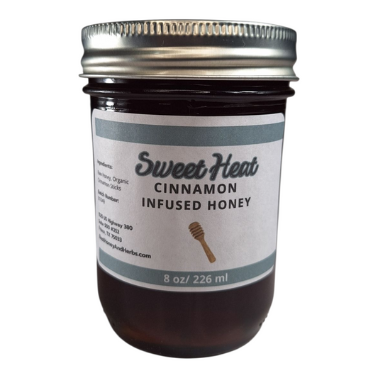 8 oz jar of raw Cinnamon Infused Honey, warm spiced sweetener for oatmeal, coffee, tea, and desserts, on a plain white background.
