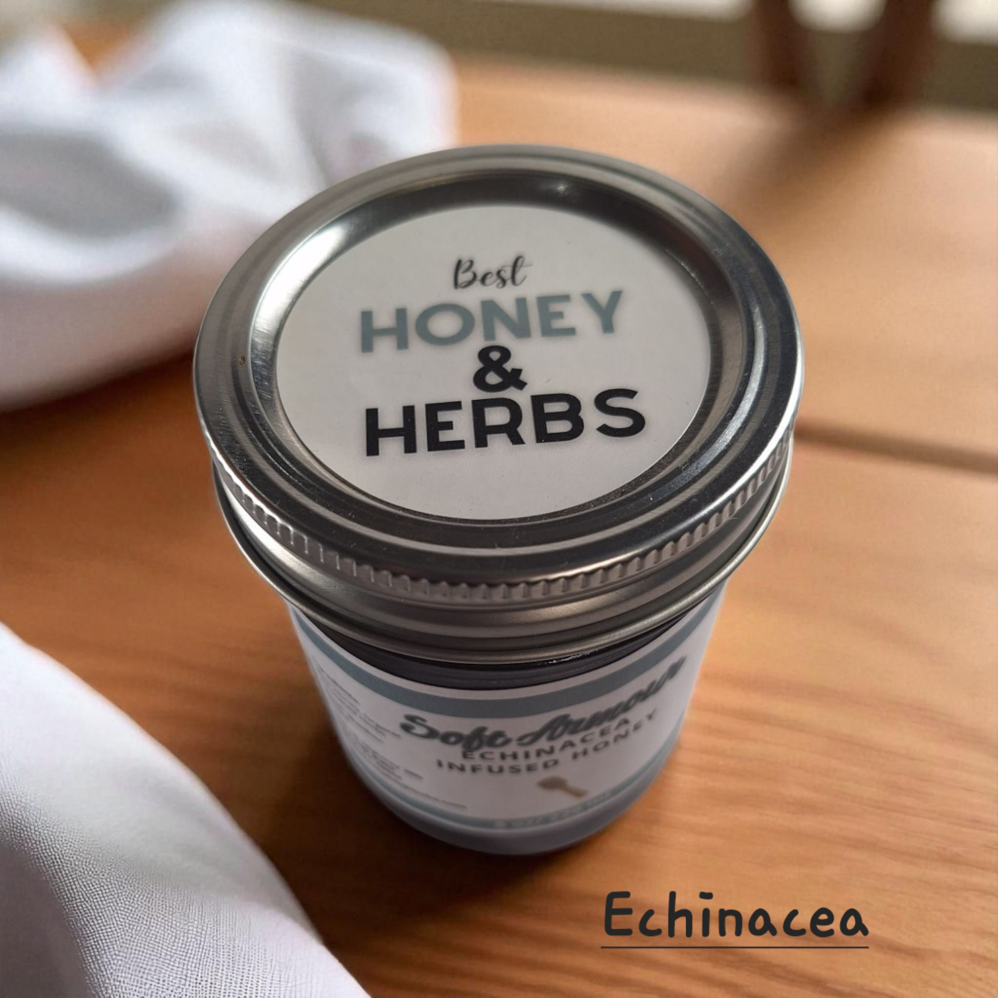 Top view of 8 oz half-pint jar of raw Echinacea Infused Honey on a rustic wooden surface, herbal sweetener for tea, immune-support drinks, and healthy recipes.