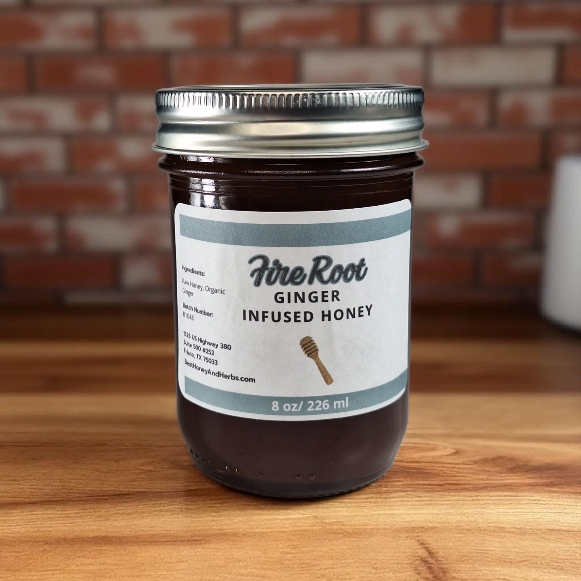 8 oz half-pint jar of raw Ginger Infused Honey on a rustic wooden surface, zesty herbal sweetener for tea, baking, and immune-boosting recipes.