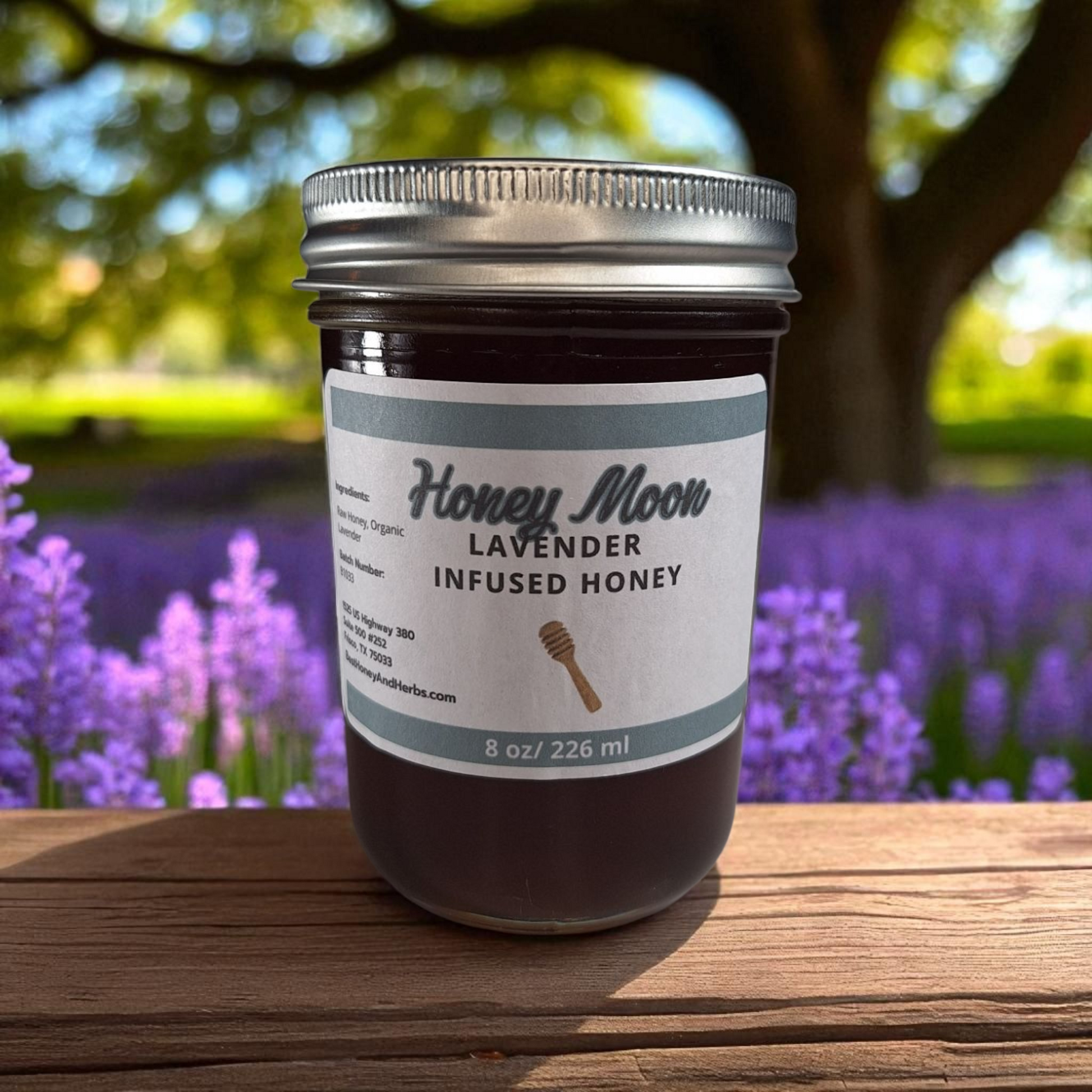 8 oz half-pint jar of raw Lavender Infused Honey on a rustic wooden surface, floral herbal sweetener for tea, baking, and relaxing drinks.