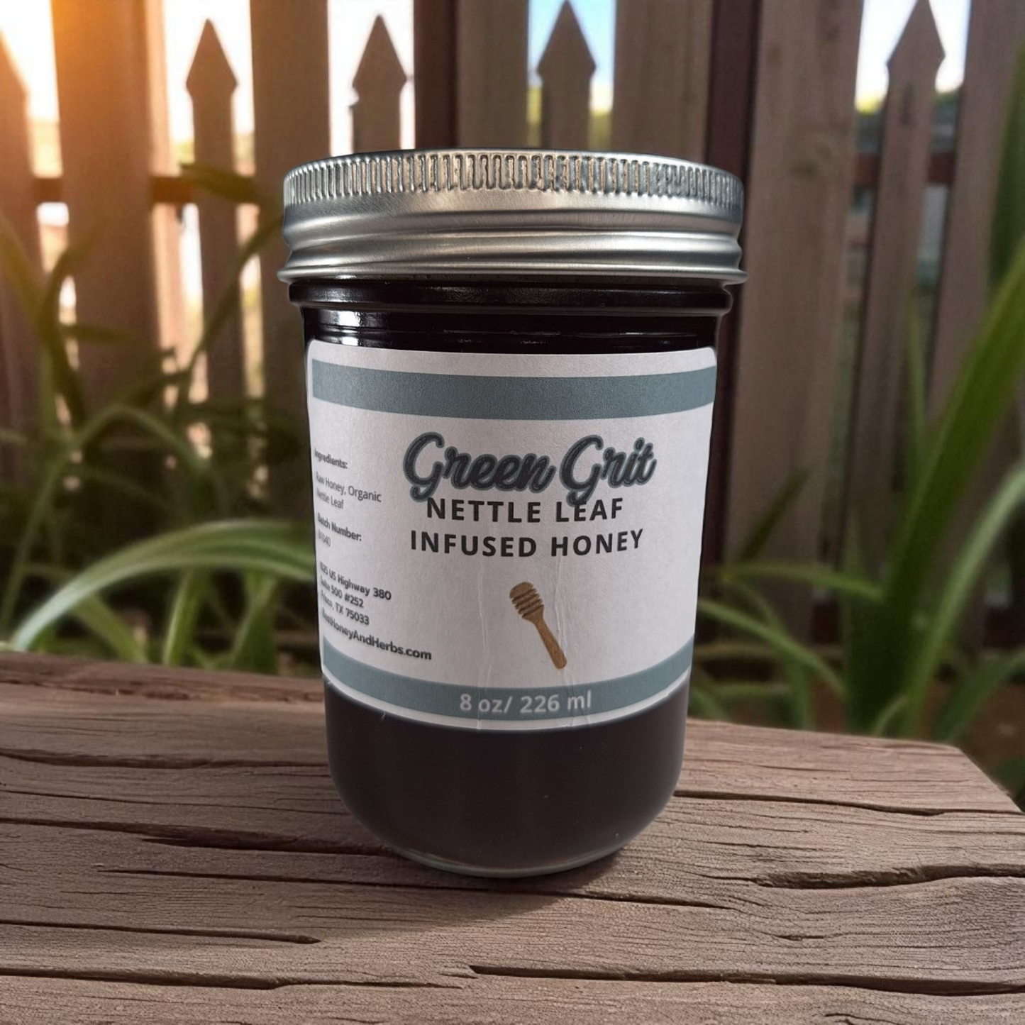 8 oz half-pint jar of raw Nettle Leaf Infused Honey on a wooden surface, nutrient-rich herbal sweetener for tea, baking, and healthy recipes.