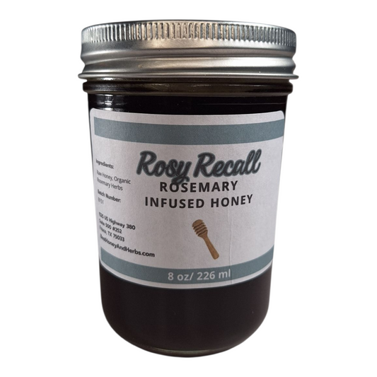 8 oz jar of raw Rosemary Infused Honey, savory herbal sweetener for meats, bread, and roasted vegetables, on a plain white background.