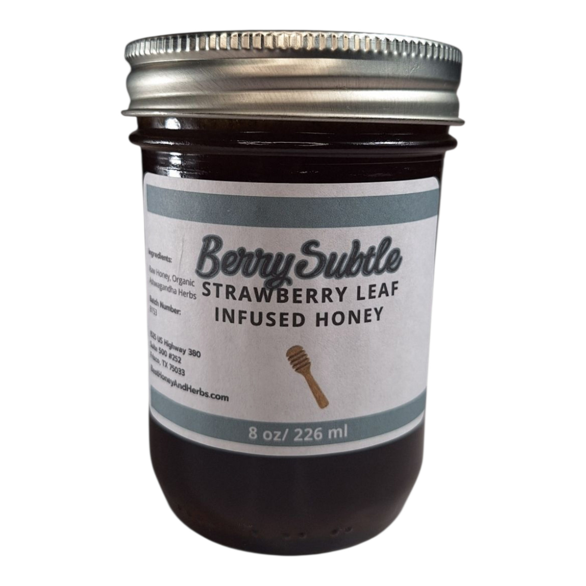 8 oz jar of raw Strawberry Leaf Infused Honey, mild herbal sweetener for tea, baking, and healthy recipes, on a plain white background.