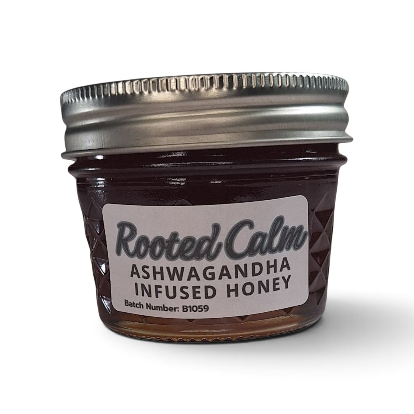  Ashwagandha-infused raw honey in a quarter pint glass jar with a metal lid.