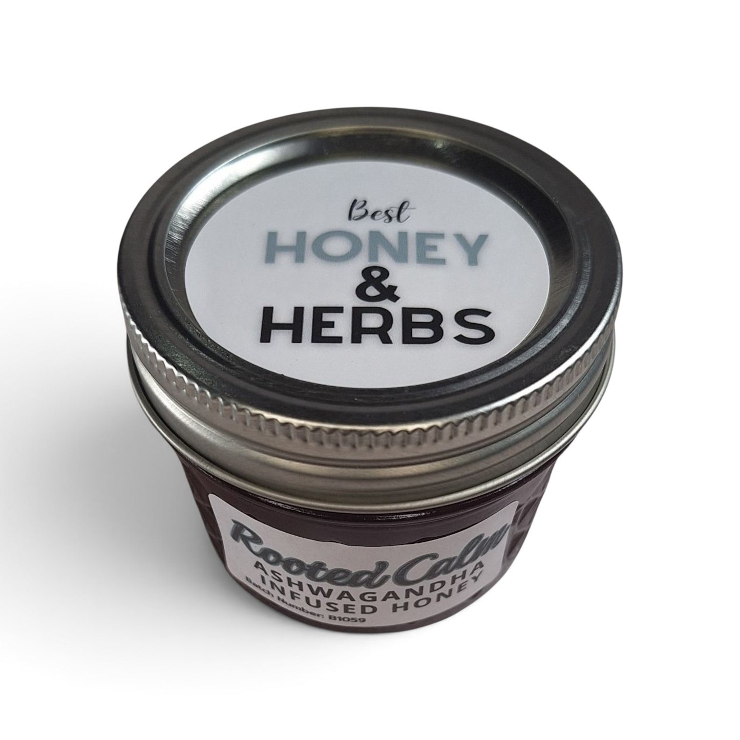  Ashwagandha infused raw honey top down view of quarter pint glass mason jar with a 
metal lid.