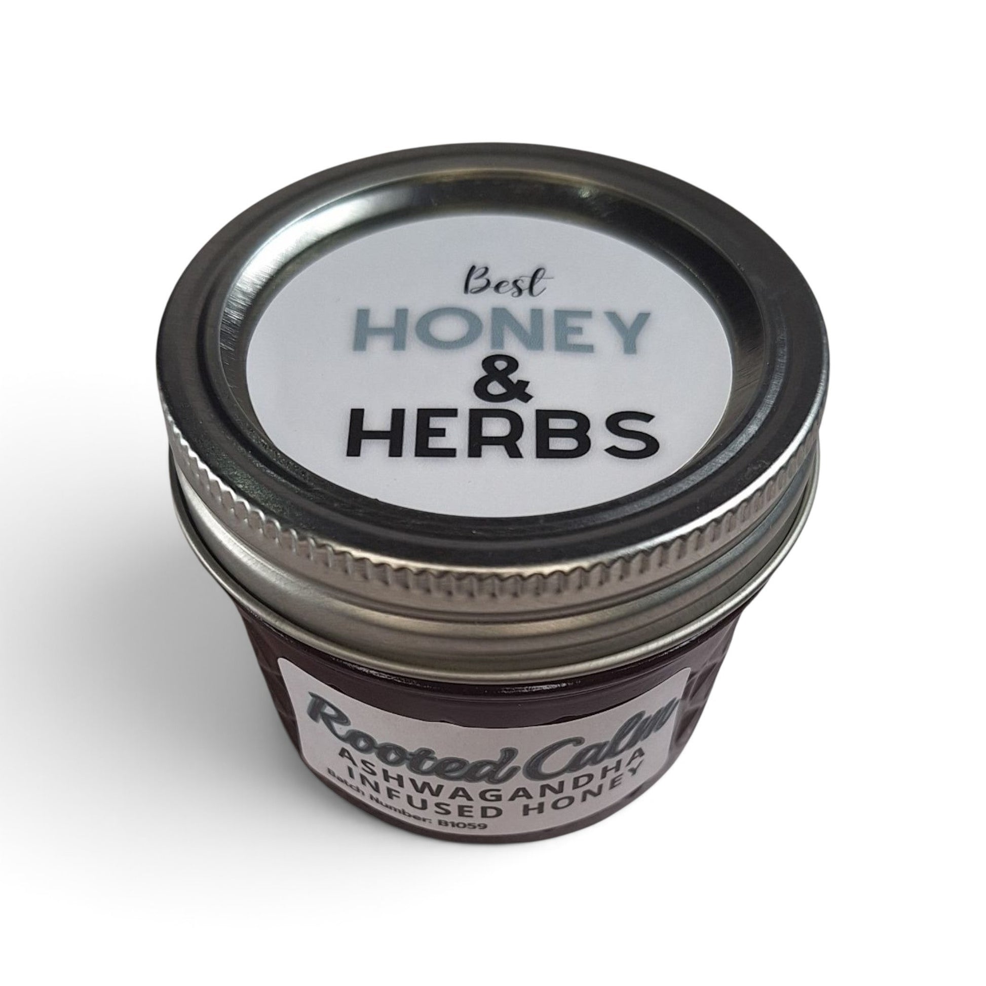  Ashwagandha infused raw honey top down view of quarter pint glass mason jar with a 
metal lid.