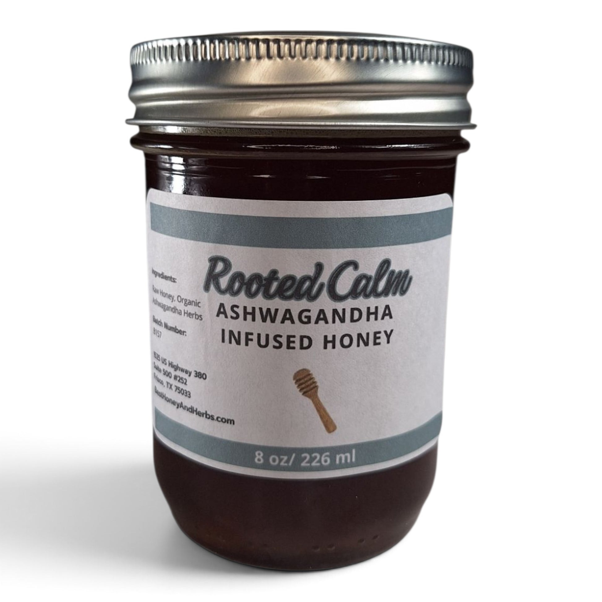  Ashwagandha infused raw honey in a glass jar with a silver lid.
