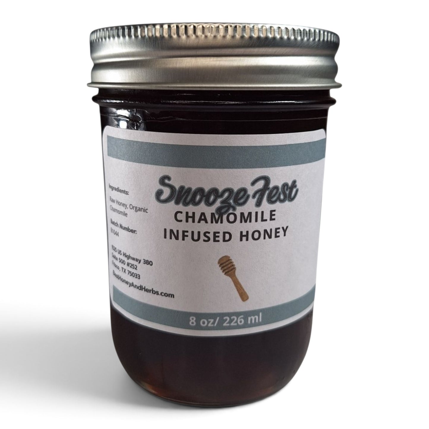  Chamomile infused raw honey in a glass jar with a metal lid.
