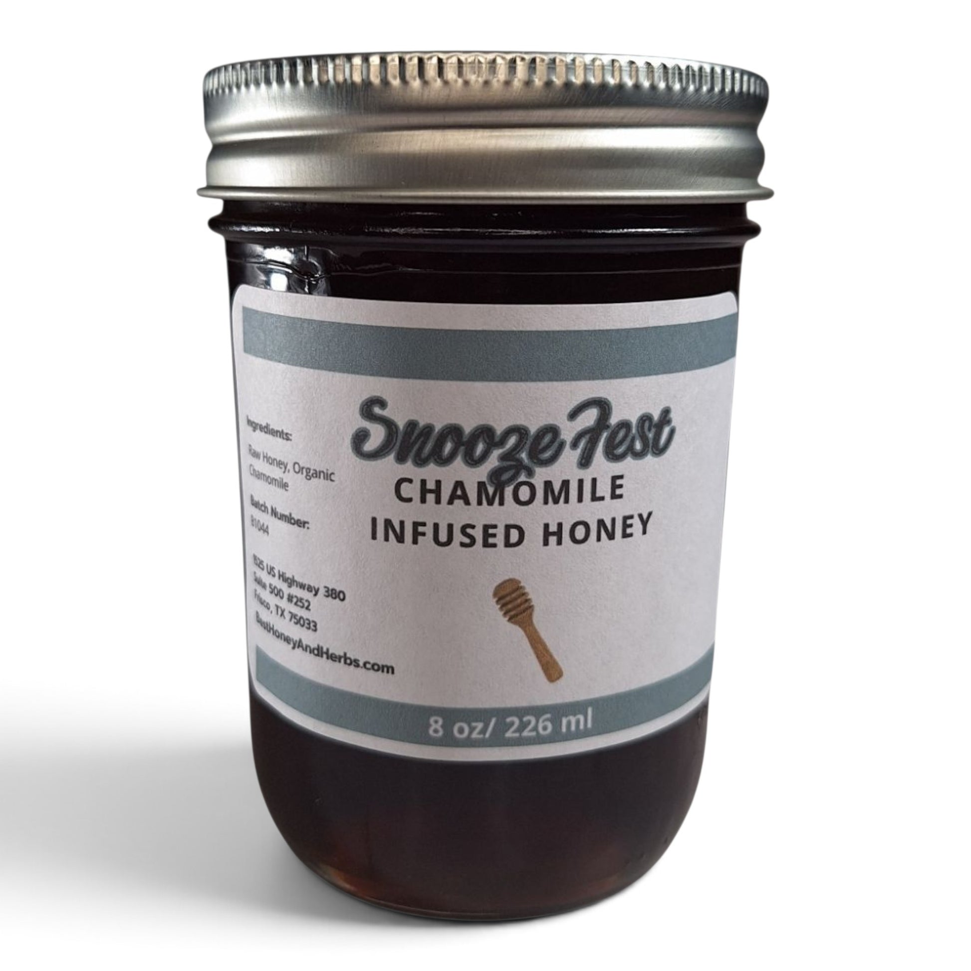  Chamomile infused raw honey in a glass jar with a metal lid.