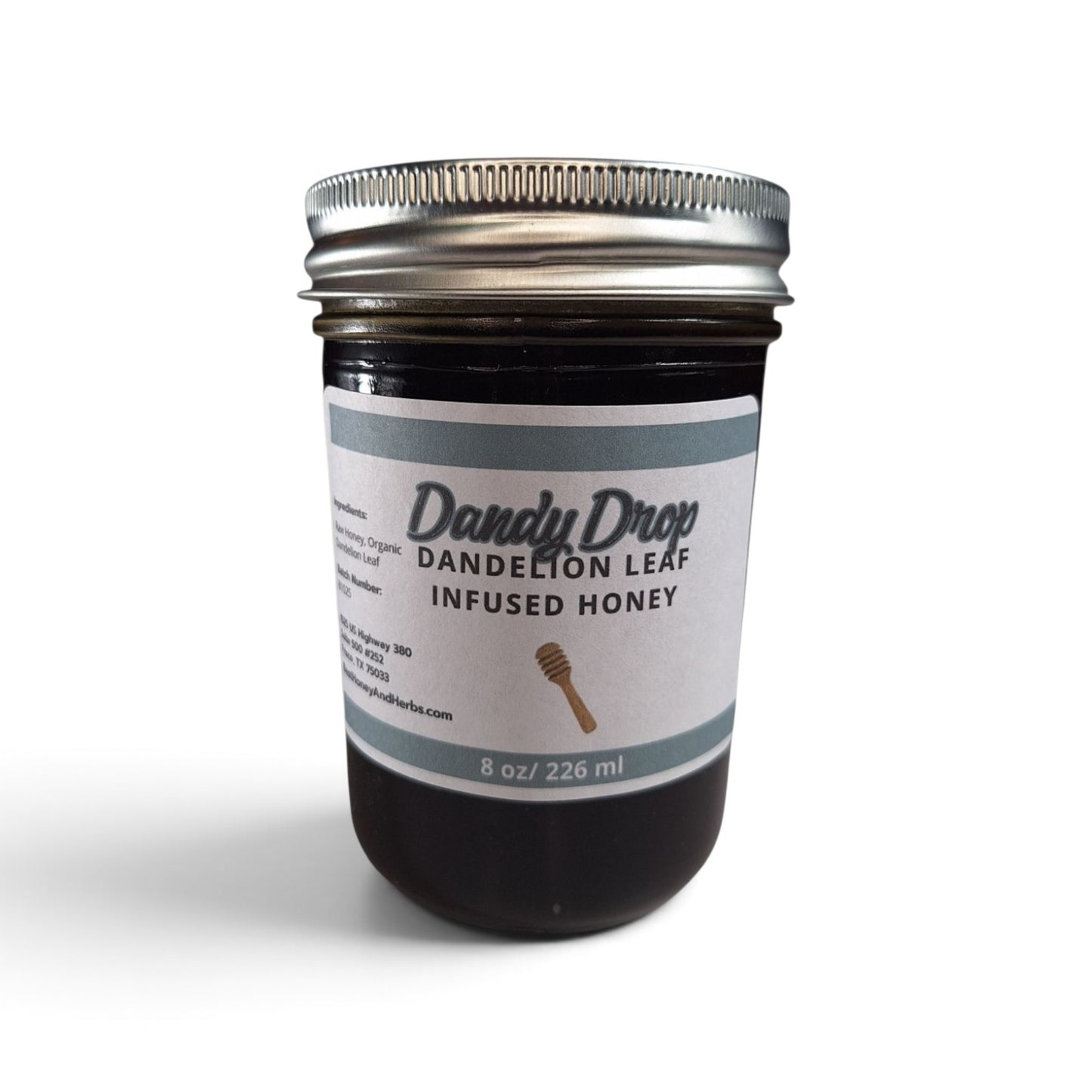  Dandelion leaf infused raw honey in an 8 oz glass jar with a silver metal lid.