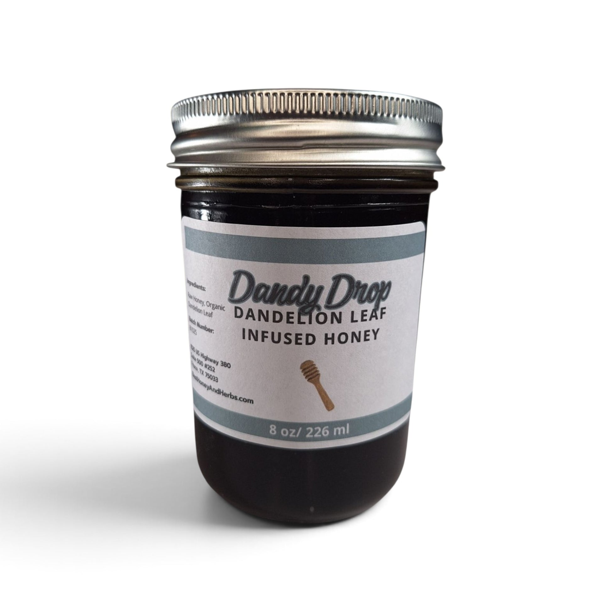  Dandelion leaf infused raw honey in an 8 oz glass jar with a silver metal lid.