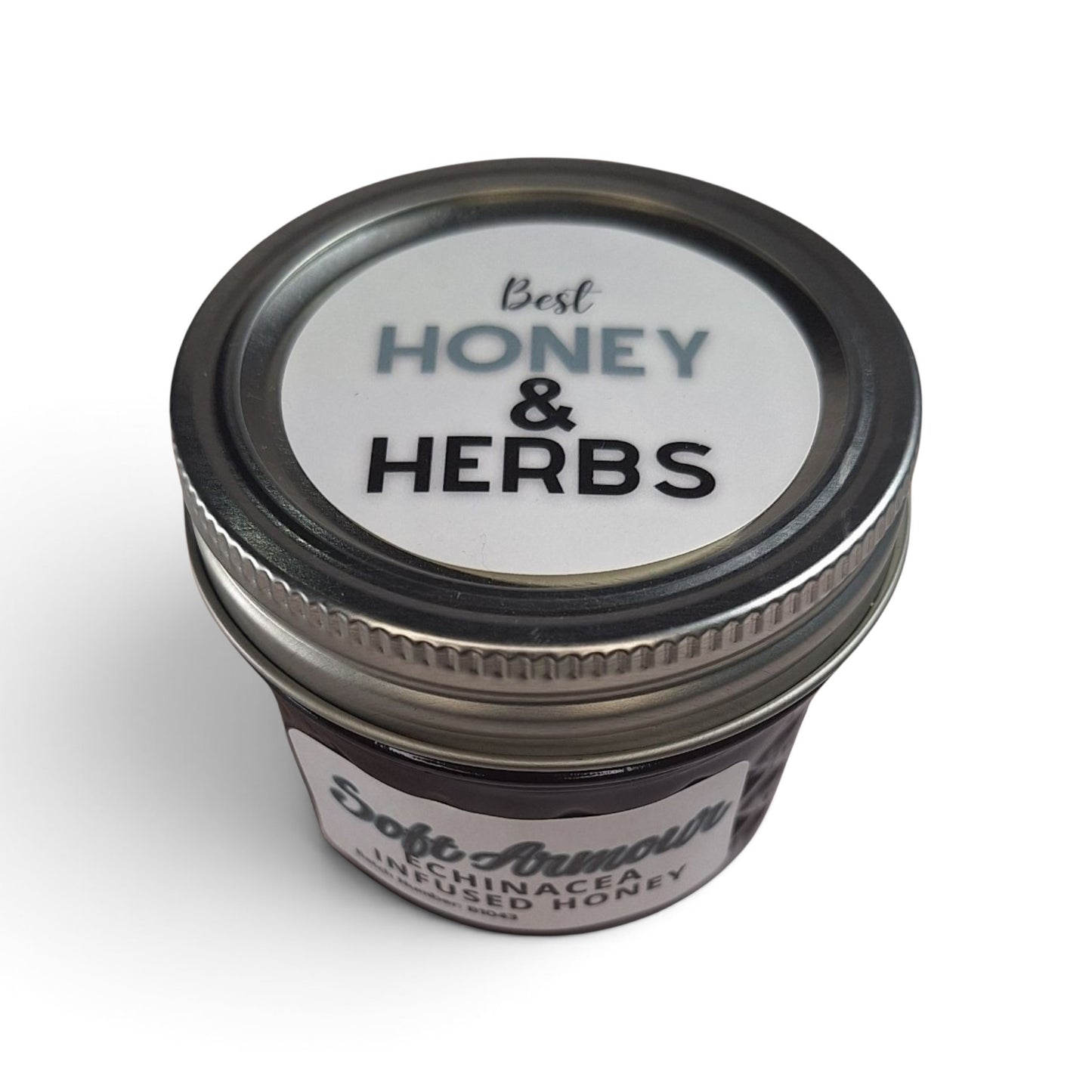  Echinacea infused raw honey in a small glass jar with a metal lid.