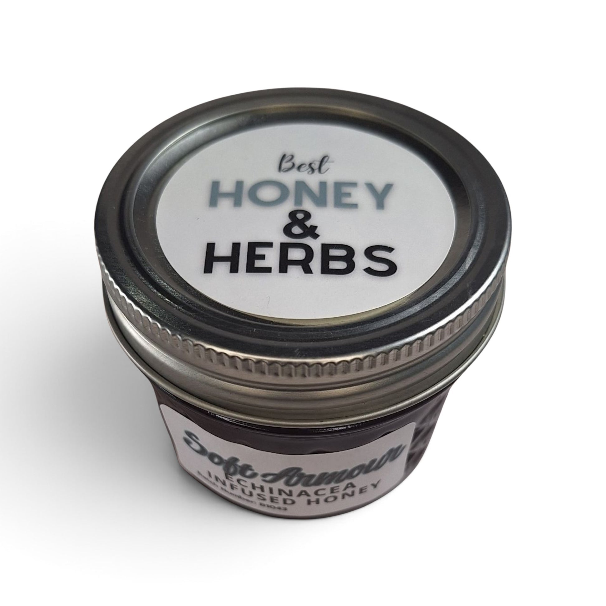  Echinacea infused raw honey in a small glass jar with a metal lid.