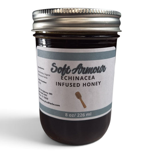  Echinacea infused raw honey in a glass mason jar with a silver lid.
