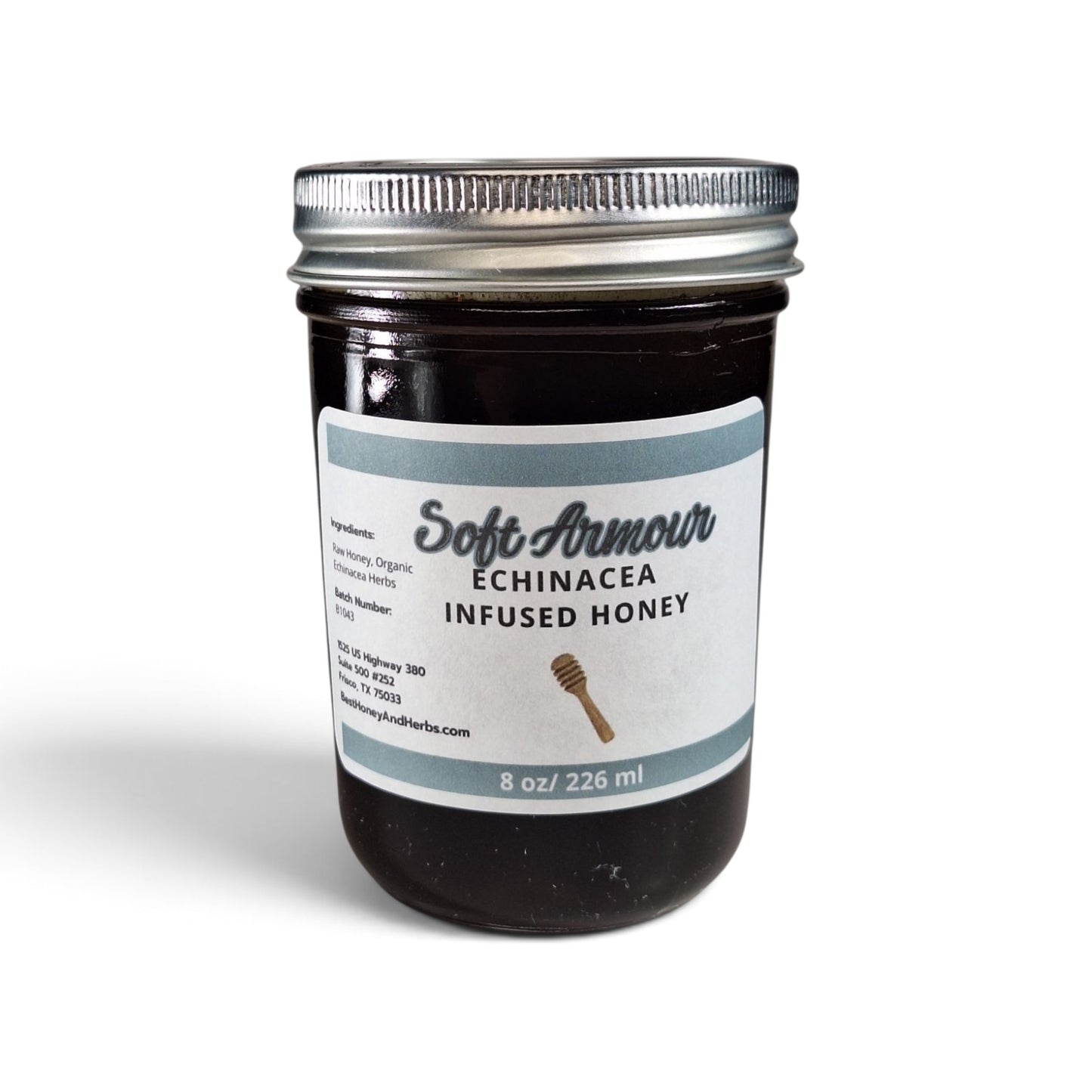  Echinacea infused honey in a half pint glass jar with a silver lid.