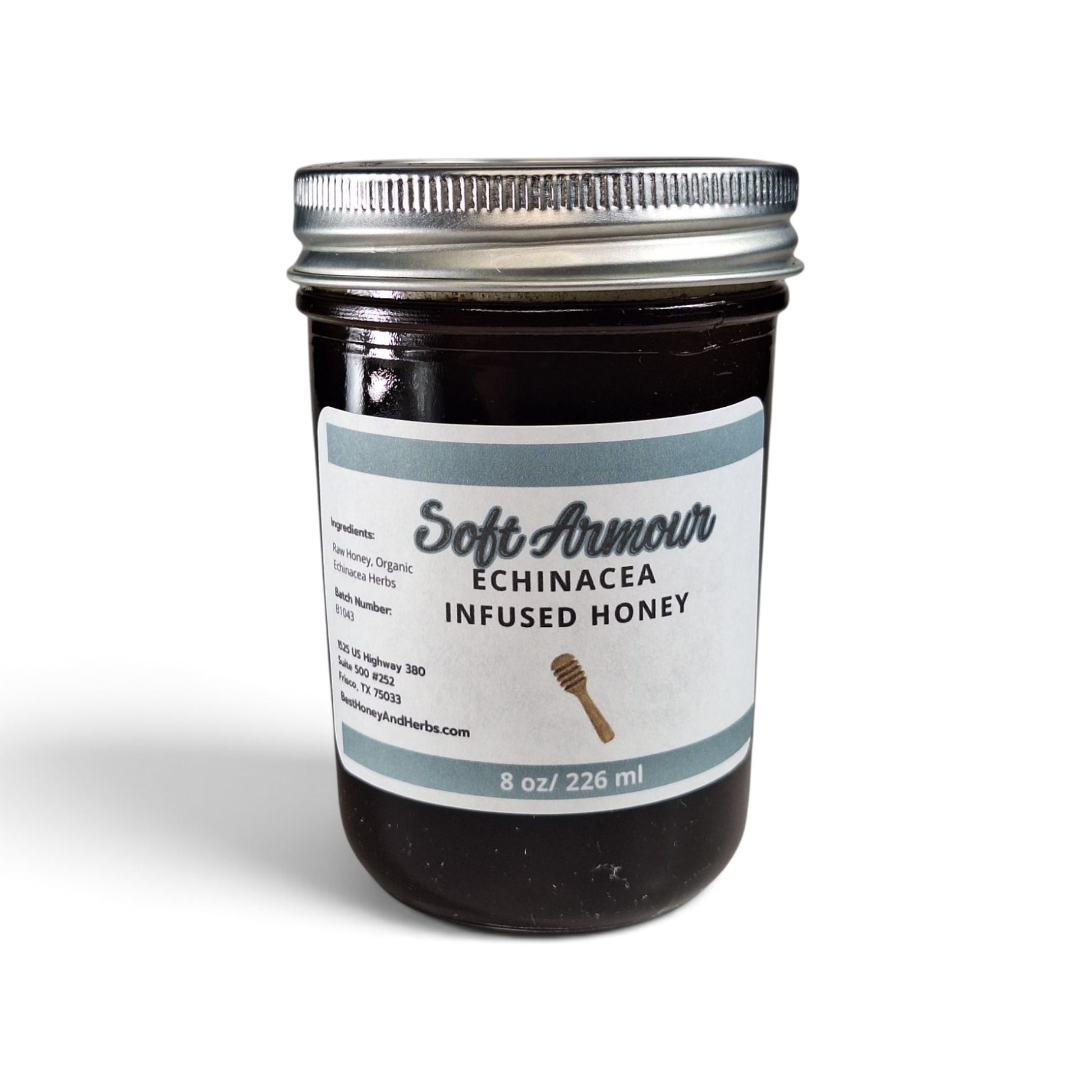  Echinacea infused honey in a half pint glass jar with a silver lid.