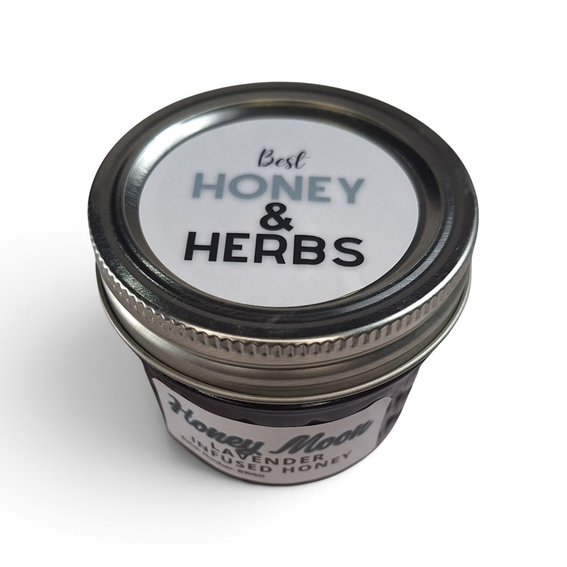  Lavender-infused raw honey in a quarter pint jar with a metal lid.