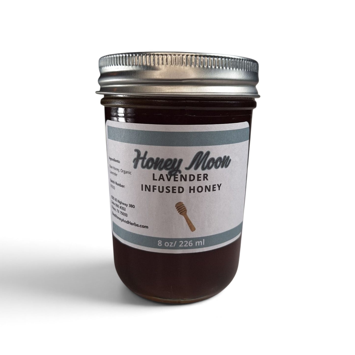  Lavender infused raw honey in an 8 oz glass jar with a silver metal lid.