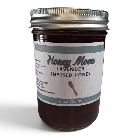  Lavender infused raw honey in a glass jar with a metal lid.