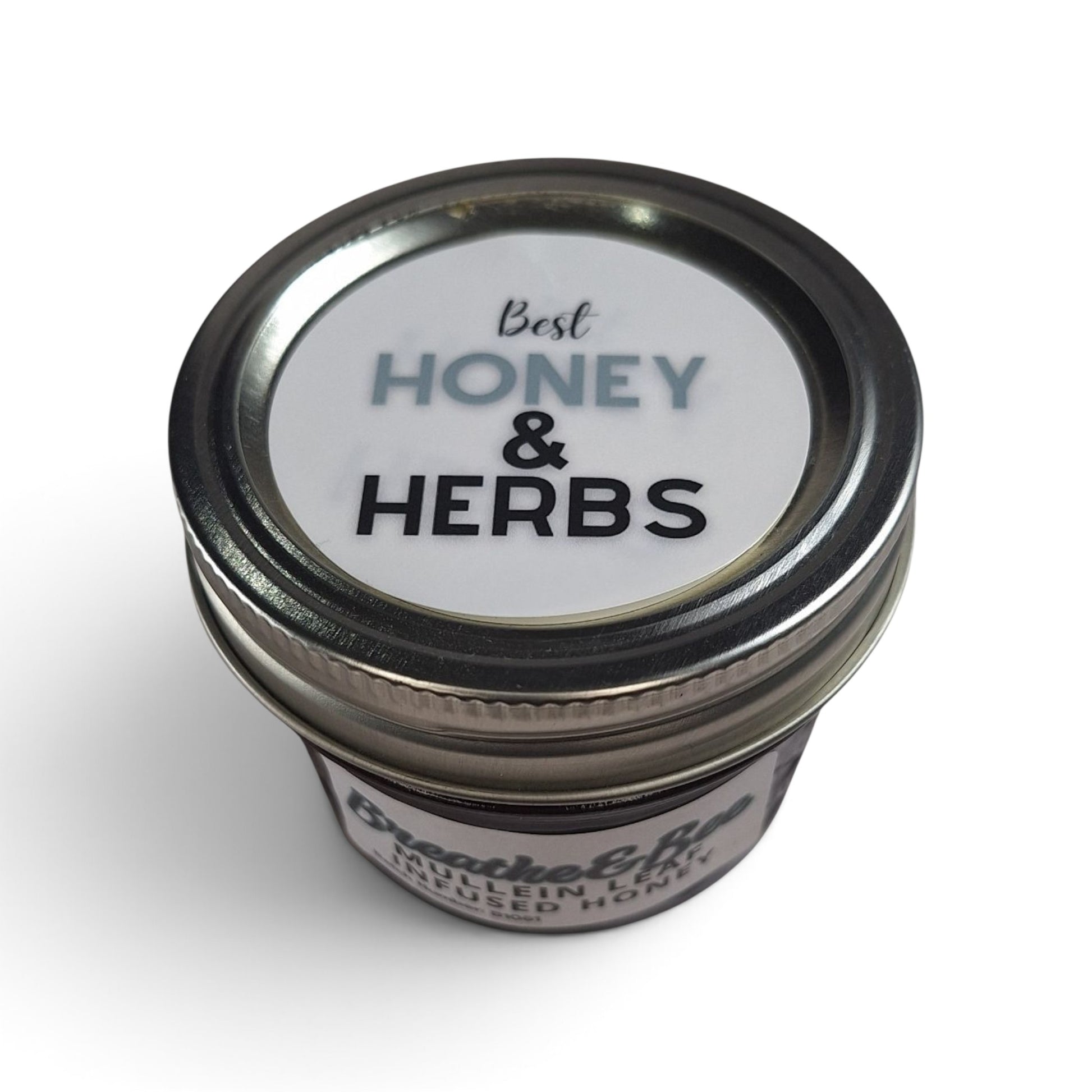  Mullein leaf infused raw honey in a small glass jar with a metal lid, top down view. 