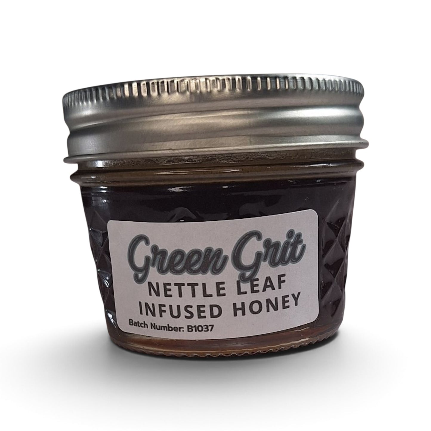 Raw honey infused with organic nettle leaf in a small glass jar.