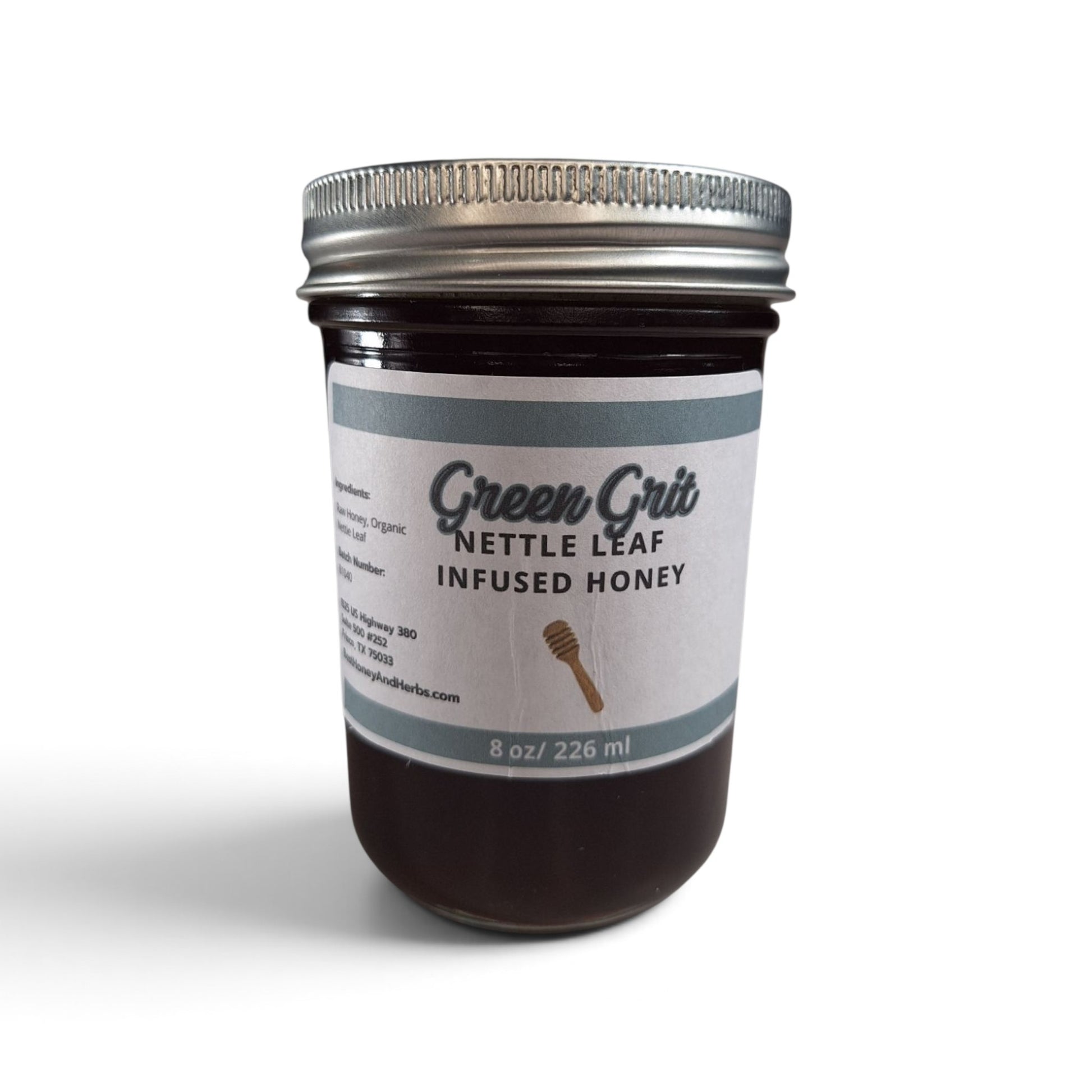 Best Honey and Herbs Green Grit nettle leaf-infused raw honey in a glass jar with a metal lid.