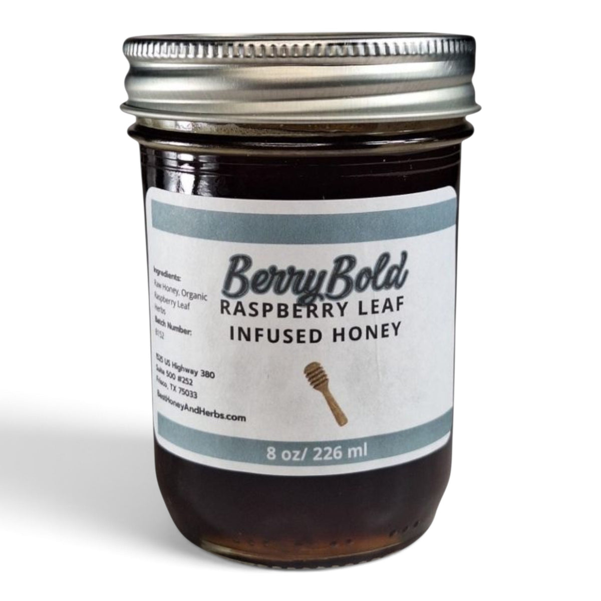  Raw honey infused with organic raspberry leaf in a glass jar with a metal lid.