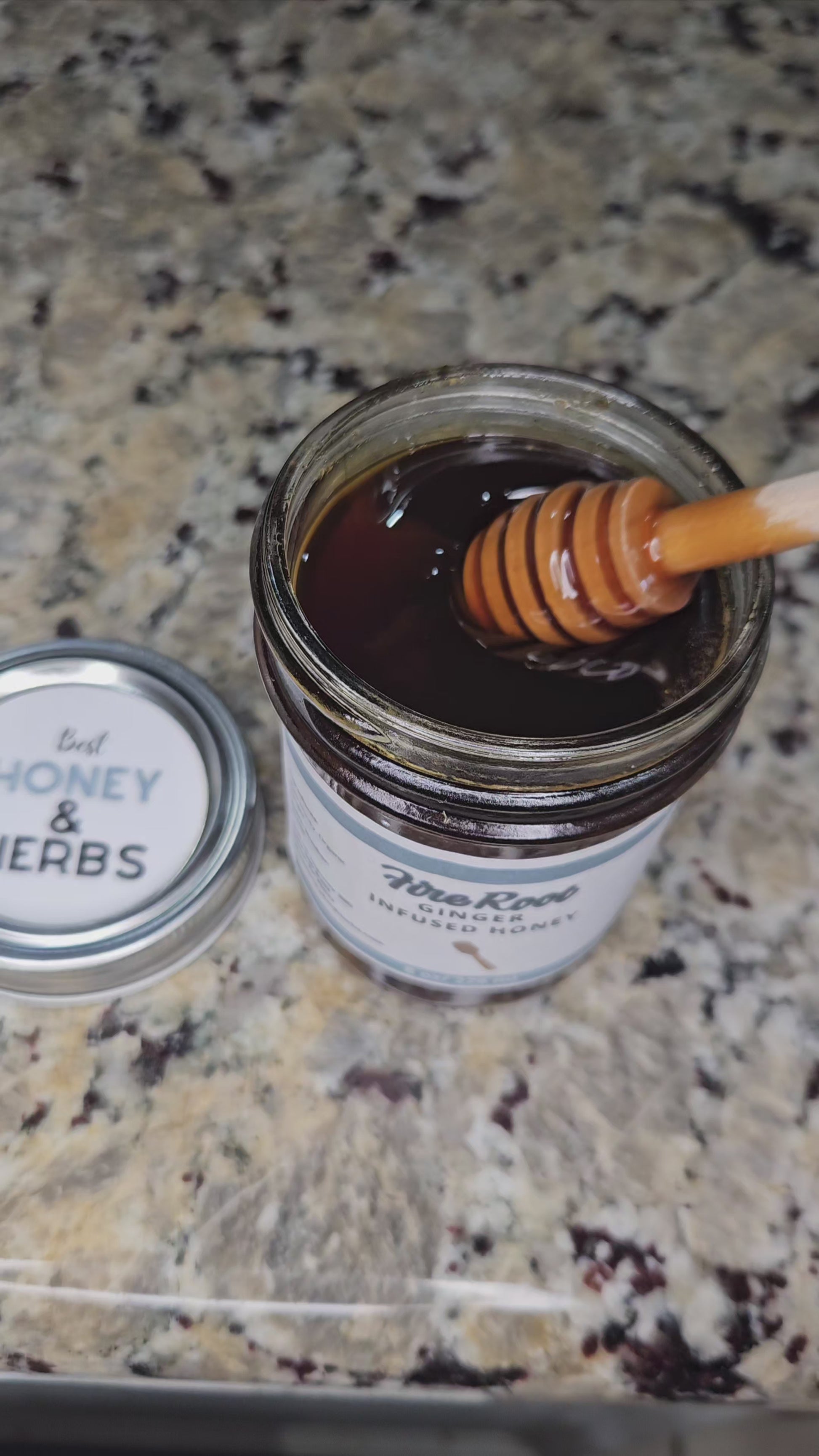 Ginger infused honey slowly drizzling from a honey dipper.