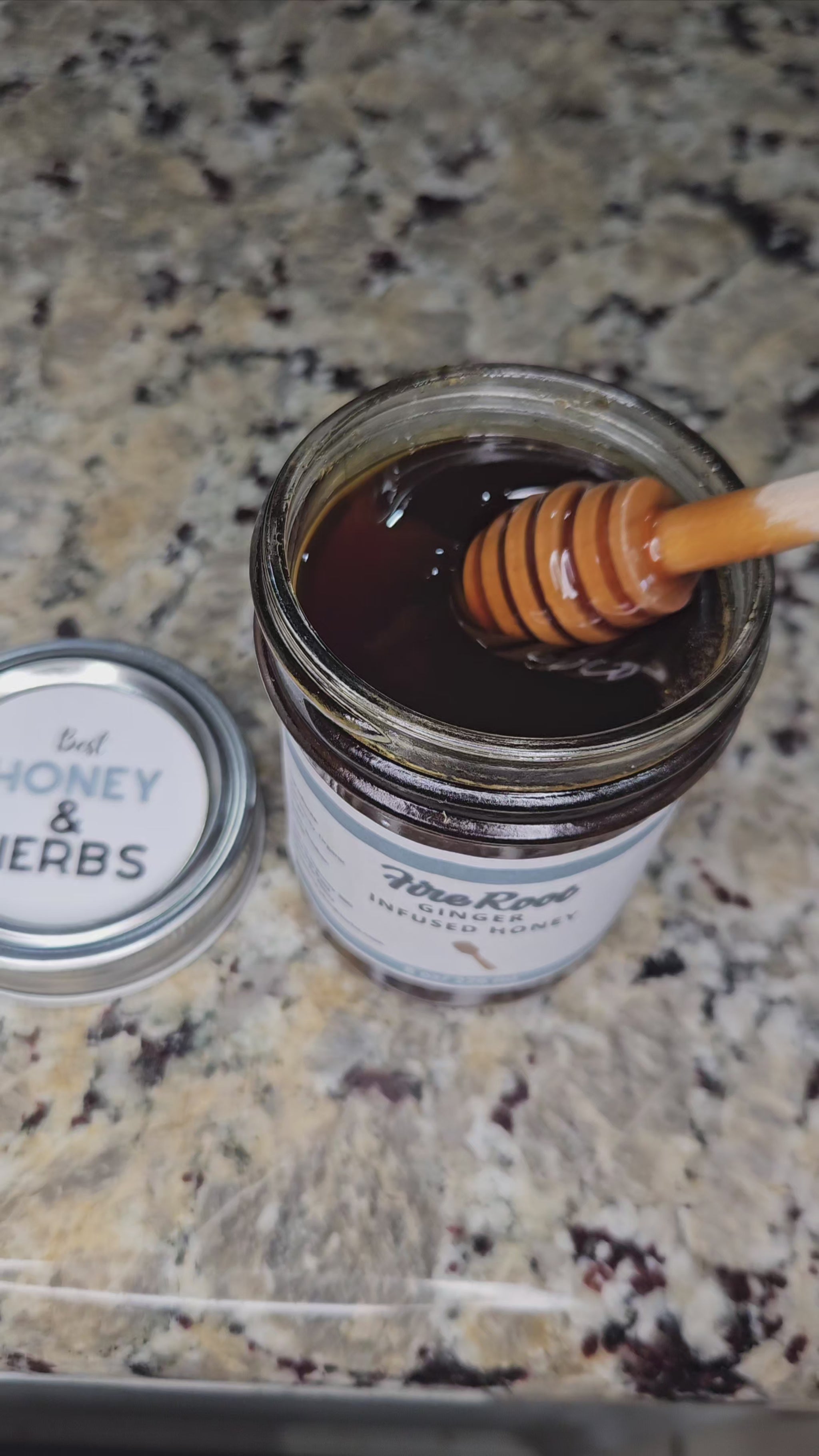Ginger infused honey slowly drizzling from a honey dipper.