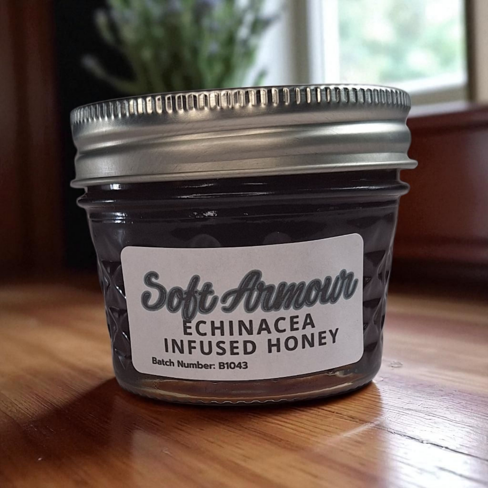4 oz jar of raw Echinacea Infused Honey on a rustic wooden surface, herbal sweetener for tea, immune-support drinks, and healthy recipes.