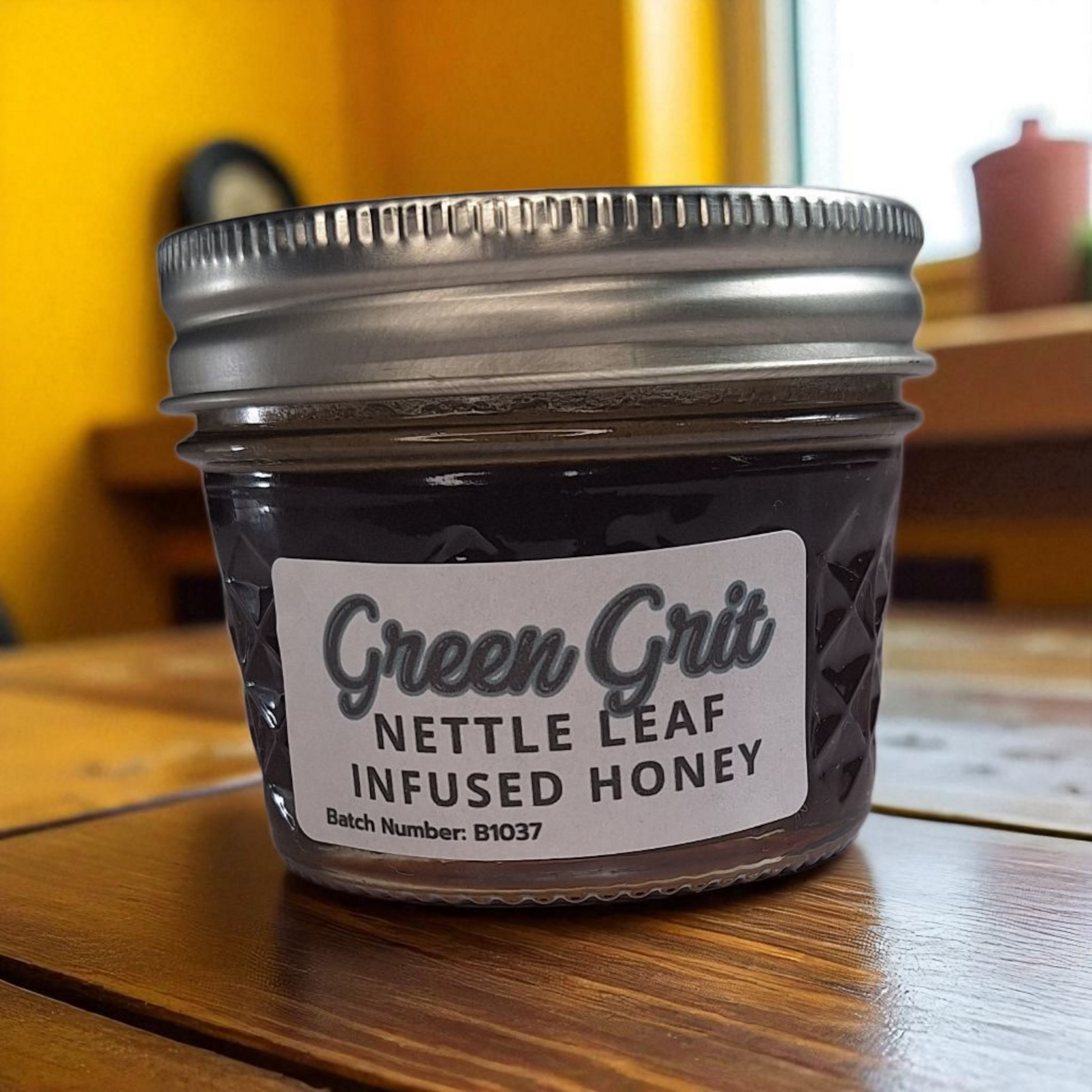4 oz jar of raw Nettle Leaf Infused Honey on a wooden surface, nutrient-rich herbal sweetener for tea, baking, and healthy recipes.