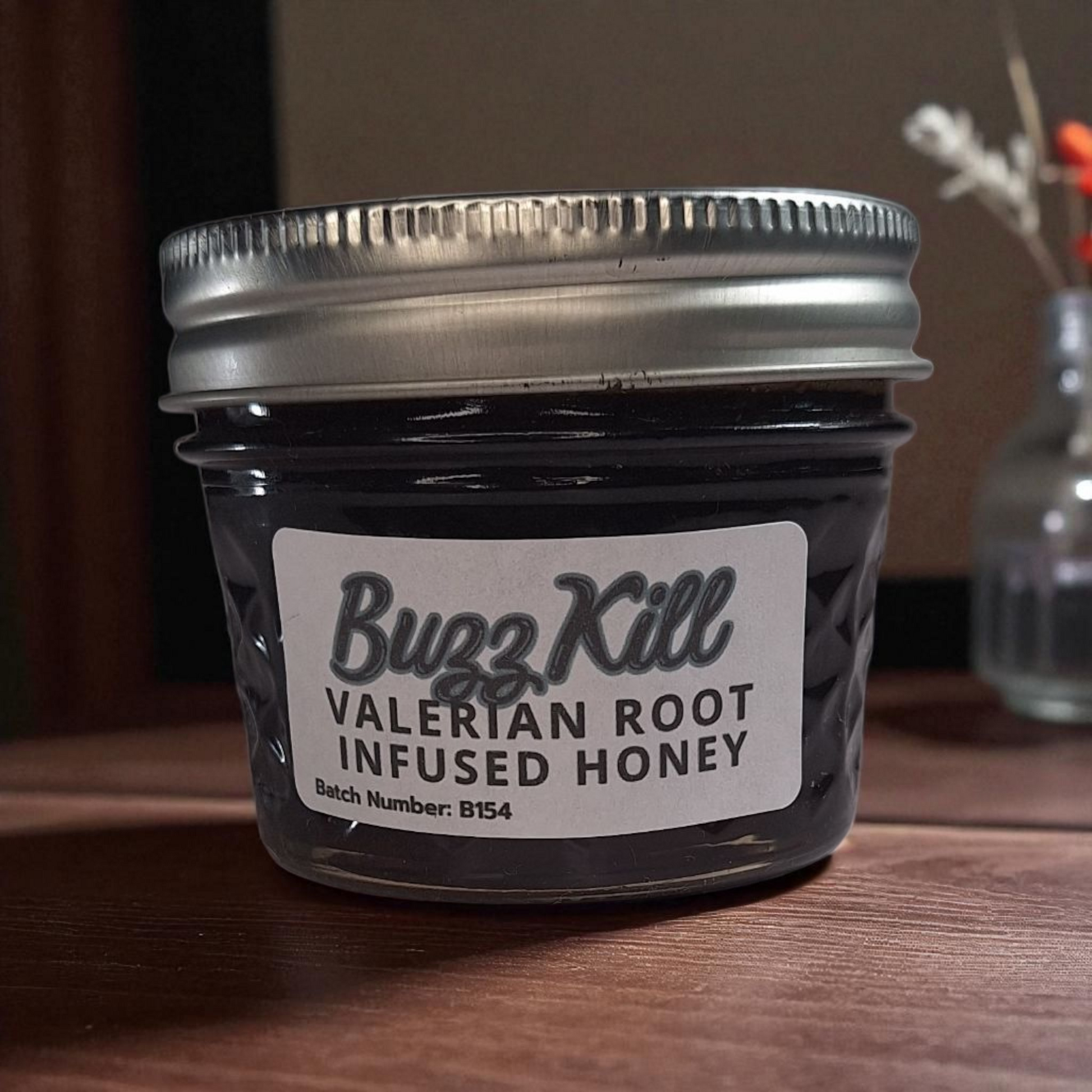 Valerian Root Infused Honey – 4 oz jar of raw Valerian Root Infused Honey on a rustic wooden surface, herbal sweetener for tea, desserts, and natural relaxation recipes.