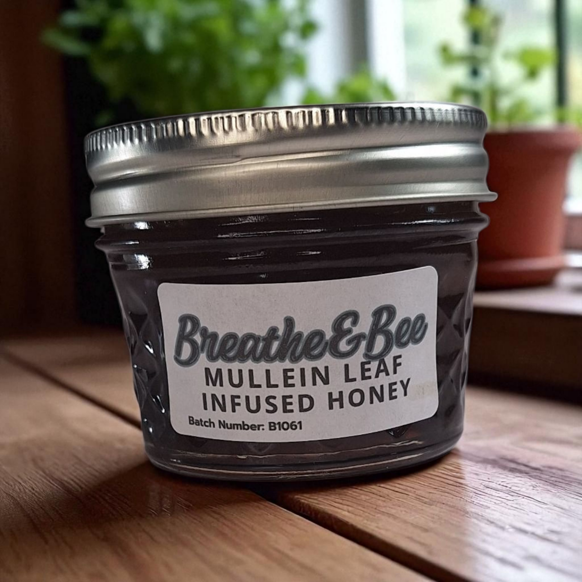 4 oz jar of raw Mullein Leaf Infused Honey on a rustic wooden surface, soothing herbal sweetener for tea, throat comfort, and natural wellness.