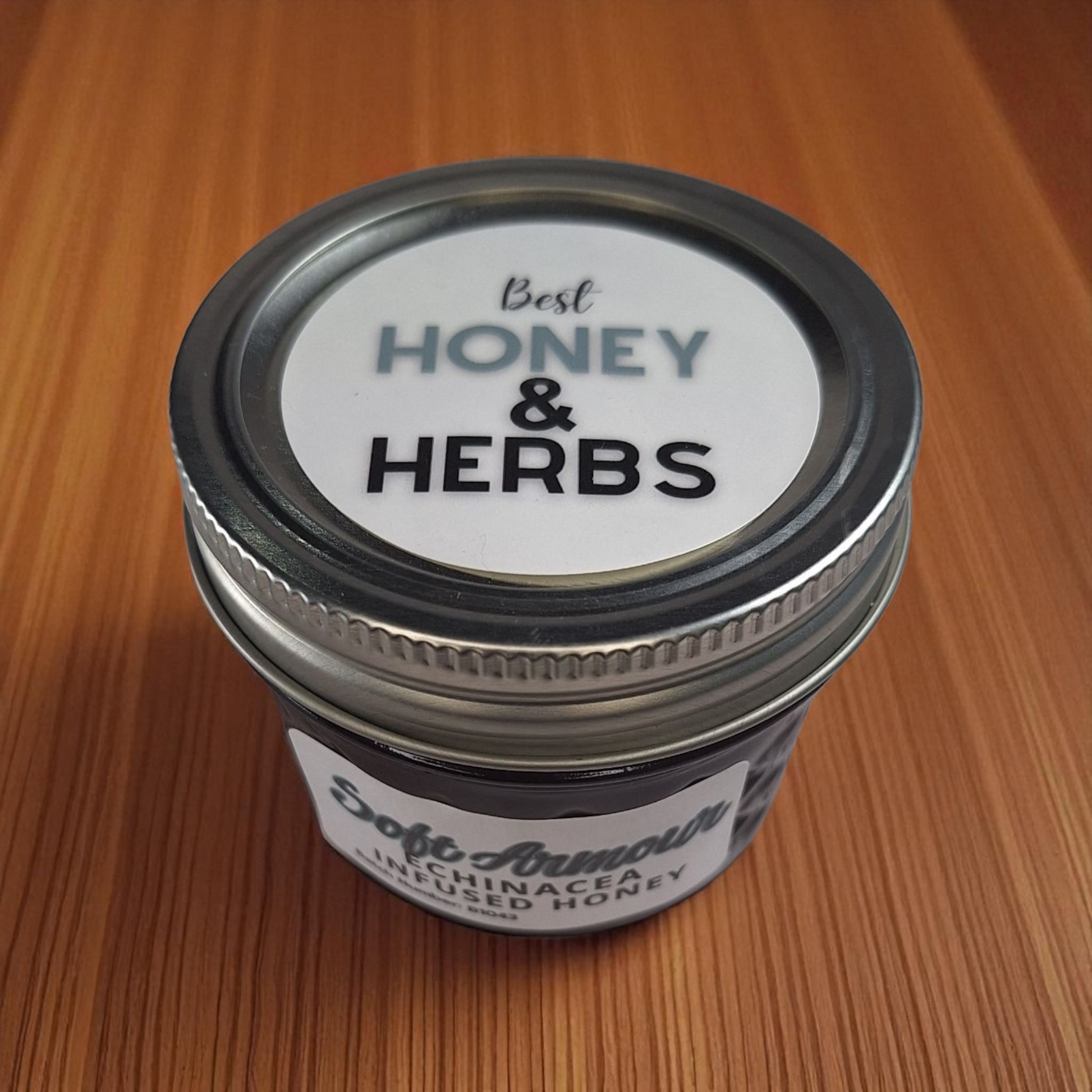Shot from above: 4 oz Echinacea Infused Honey on a wood plank; small-batch herbal honey for soothing teas and homemade syrups.